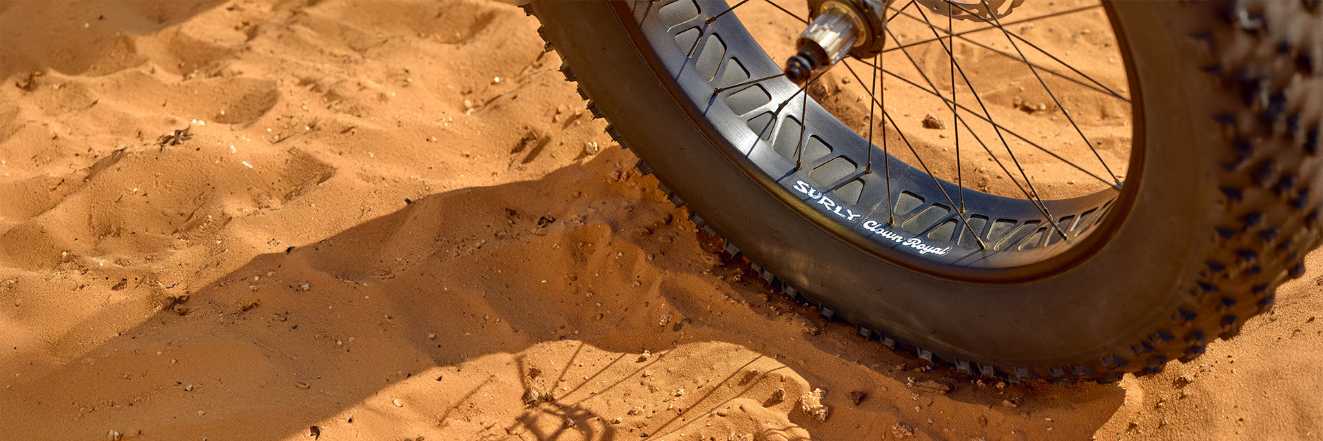 Close-up of Surly Rim with fat tire on sand