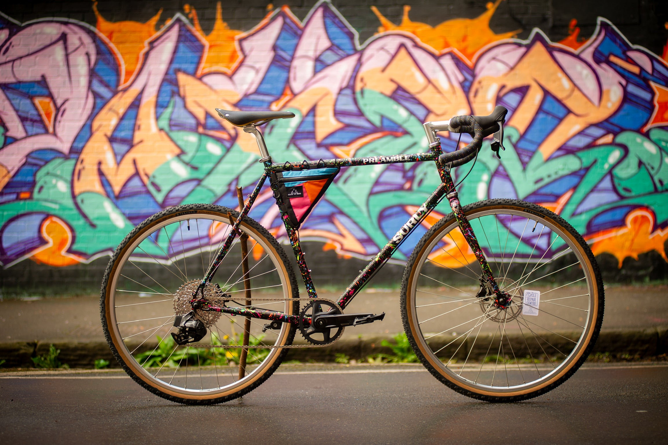 Side view of custom painted Surly Preamble with mural in background