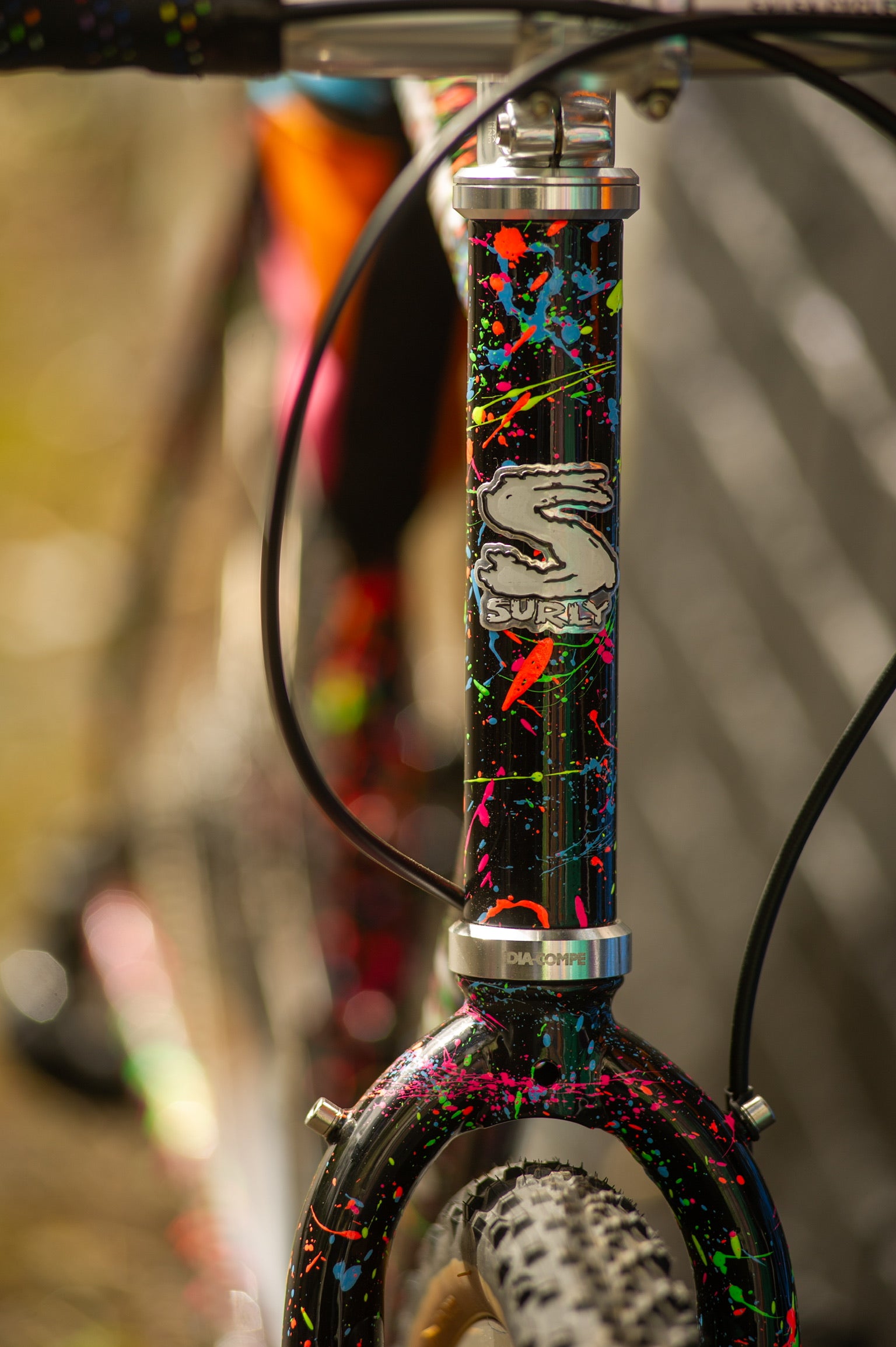 Head tube area detail of custom splatter painted Surly Preamble bike
